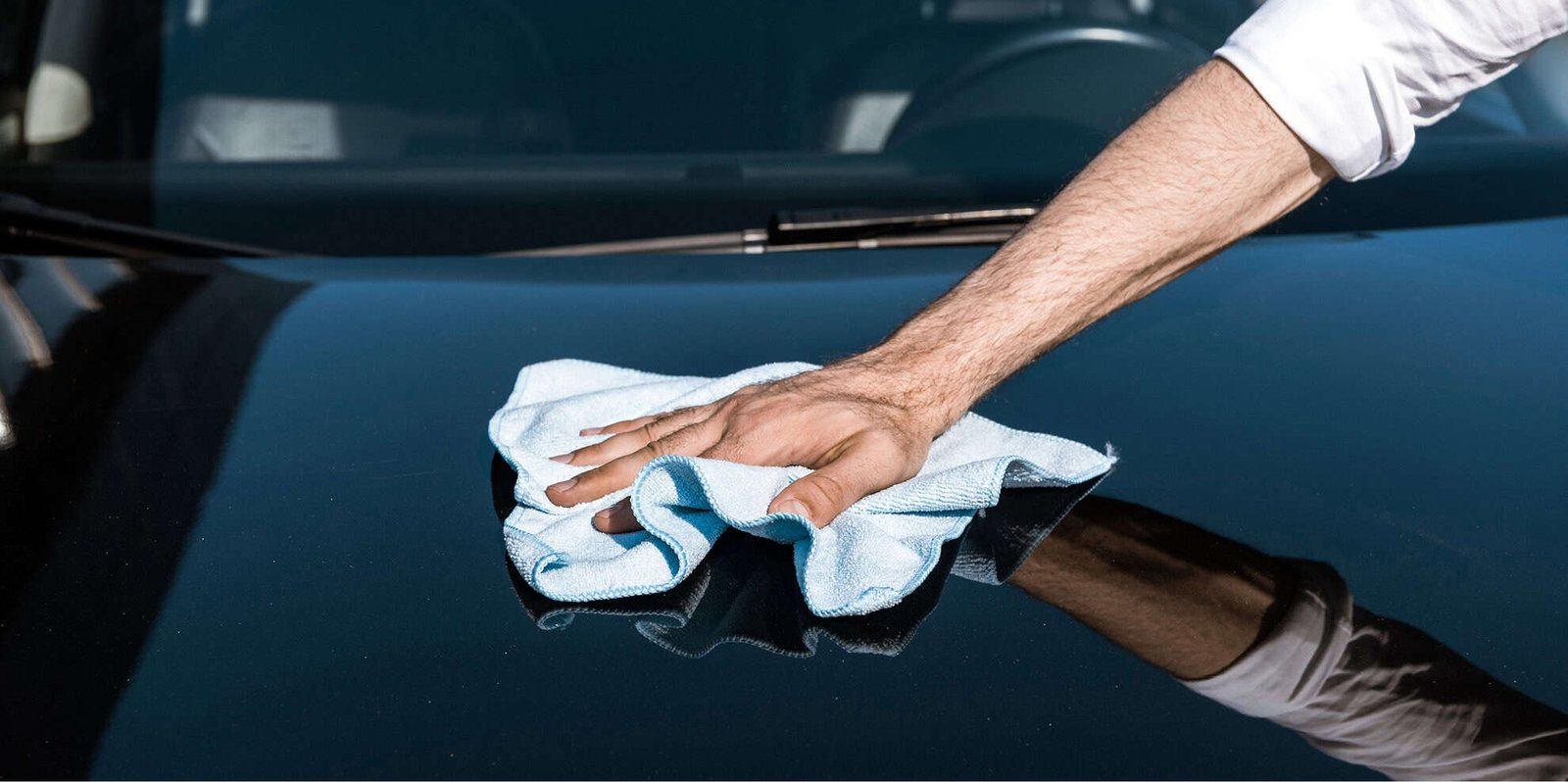 cropped-view-of-man-cleaning-black-car-with-white-2024-11-19-16-49-40-utc