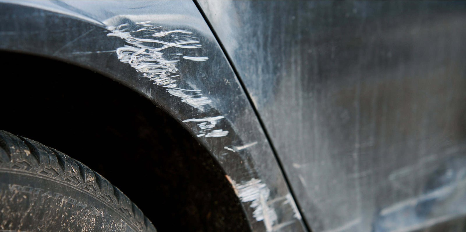damaged-car-door-and-rear-fender-at-street-2025-03-14-00-34-35-utc